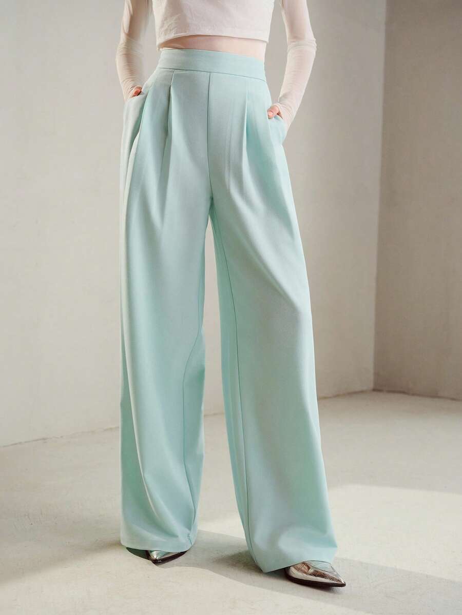 Calça feminina elegante de perna larga com bolsos
