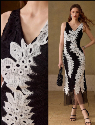 Detalhe da renda guipir preta e branca aplicada sobre tule do vestido feminino
