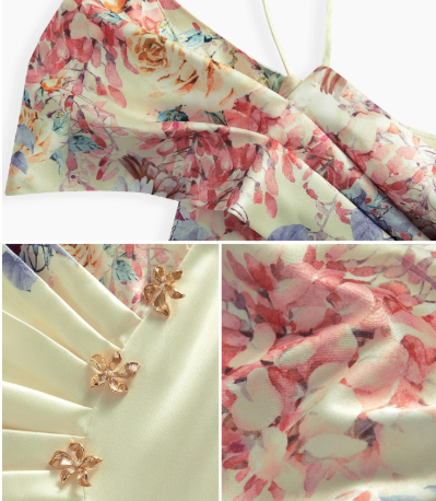Detalhe das pequenas aplicações decorativas florais na lateral do vestido midi.