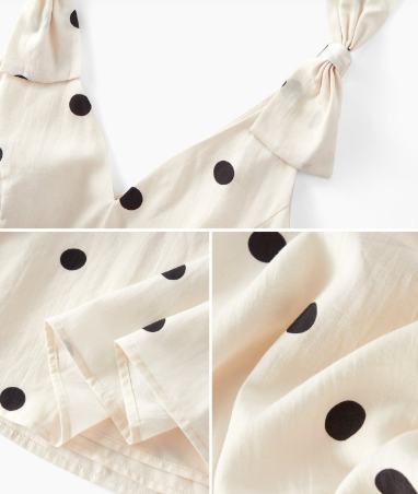 Detalhe dos laços estruturados nos ombros do vestido Creme & Preto com estampa de poá.