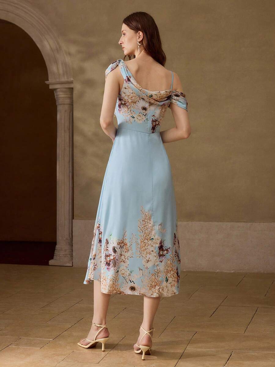 Vestido elegante Azul Sereno com estampa floral em tons suaves e comprimento midi.