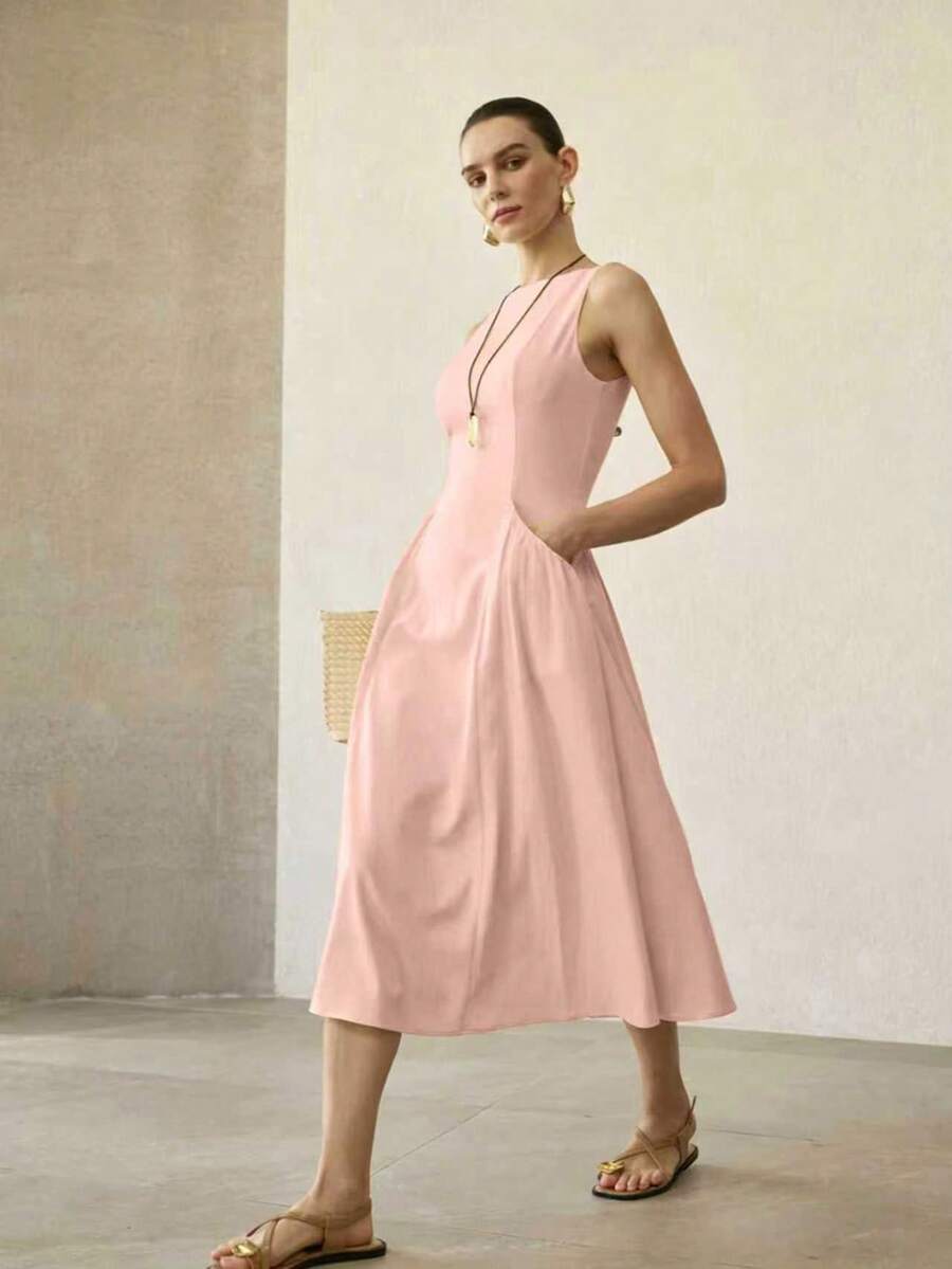 Vestido feminino midi evasê rosa suave com cintura alta
