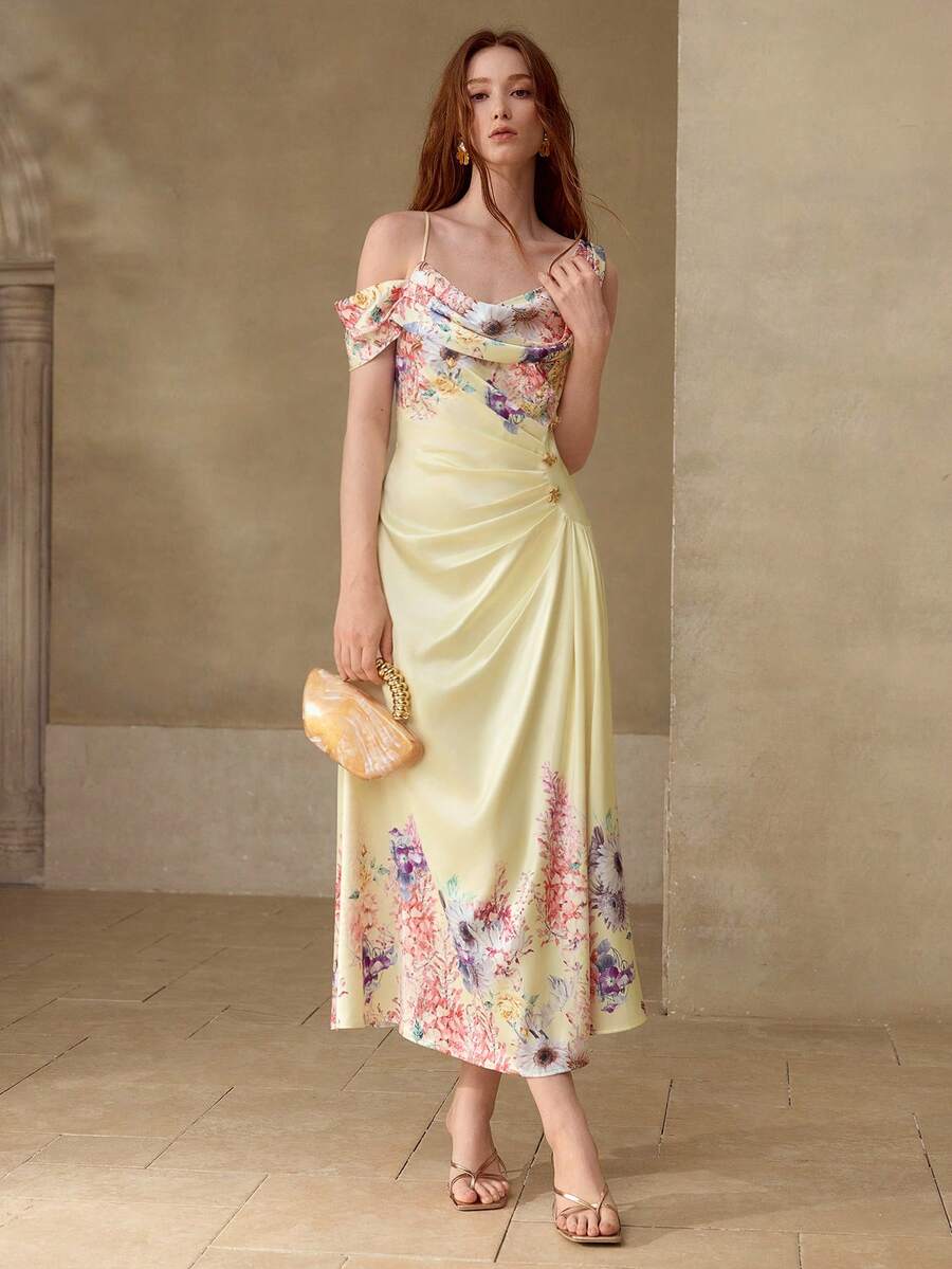 Vestido floral Baunilha Pastel com cintura alta, drapeado lateral e saia evasê.