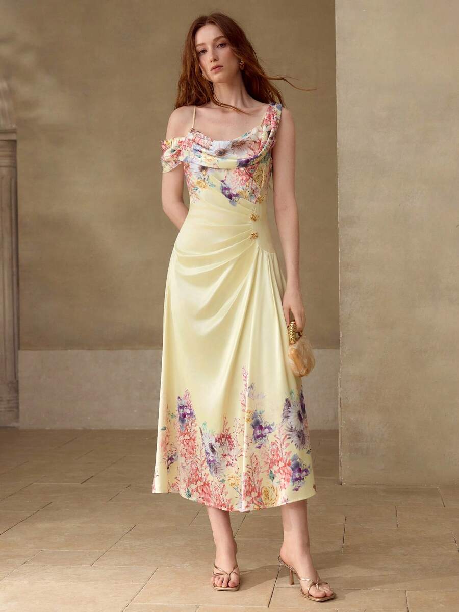 Vestido floral Baunilha Pastel com cintura alta, drapeado lateral e saia evasê.