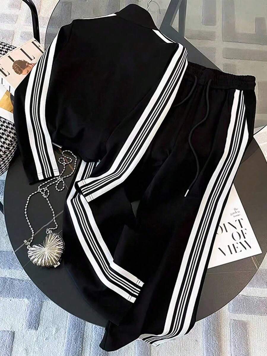 conjunto feminino na cor preta com listas brancas urbano moderno com calça pantalona